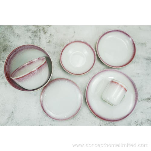 Reactive glazed stoneware dinner set with pink rim